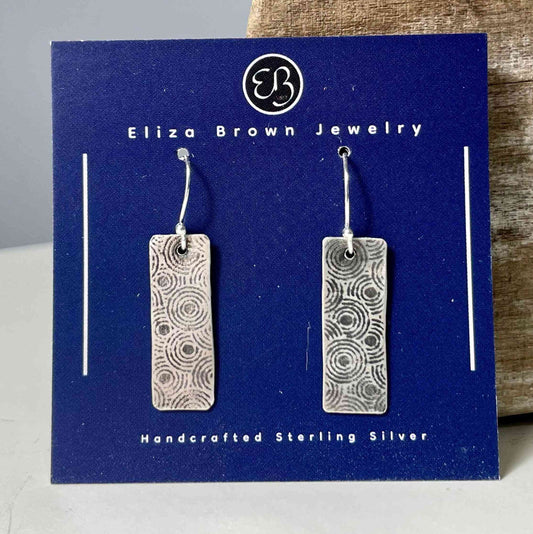 Circle Pattern Silver Earrings - Elegant Jewelry featuring rectangular sterling silver dangles with intricate circular etching, handcrafted design.