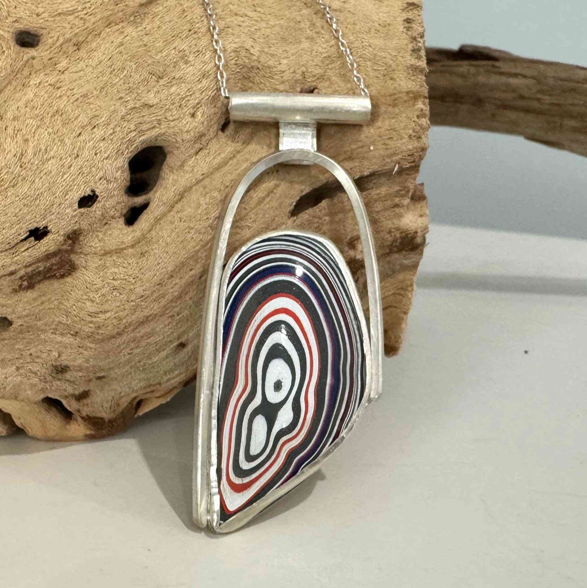 Modern Silver Fordite Necklace featuring a bold, multicolored Fordite cabochon in a handcrafted sterling silver pendant setting.