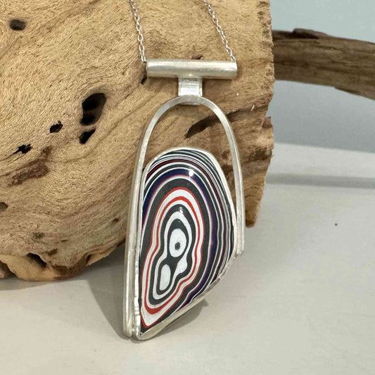 Modern Silver Fordite Necklace featuring a bold, multicolored Fordite cabochon in a handcrafted sterling silver pendant setting.