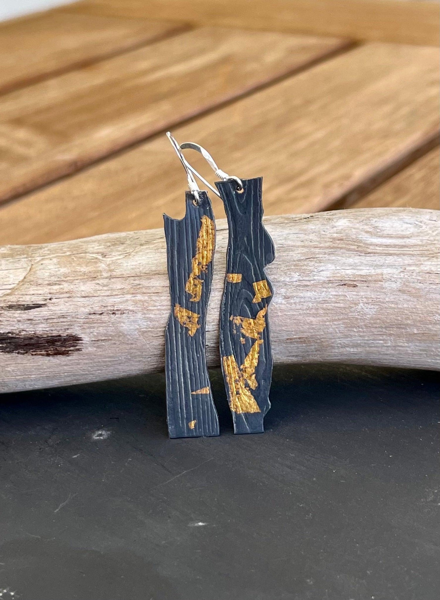 Keum-Boo black textured earrings with fused gold foil accents.