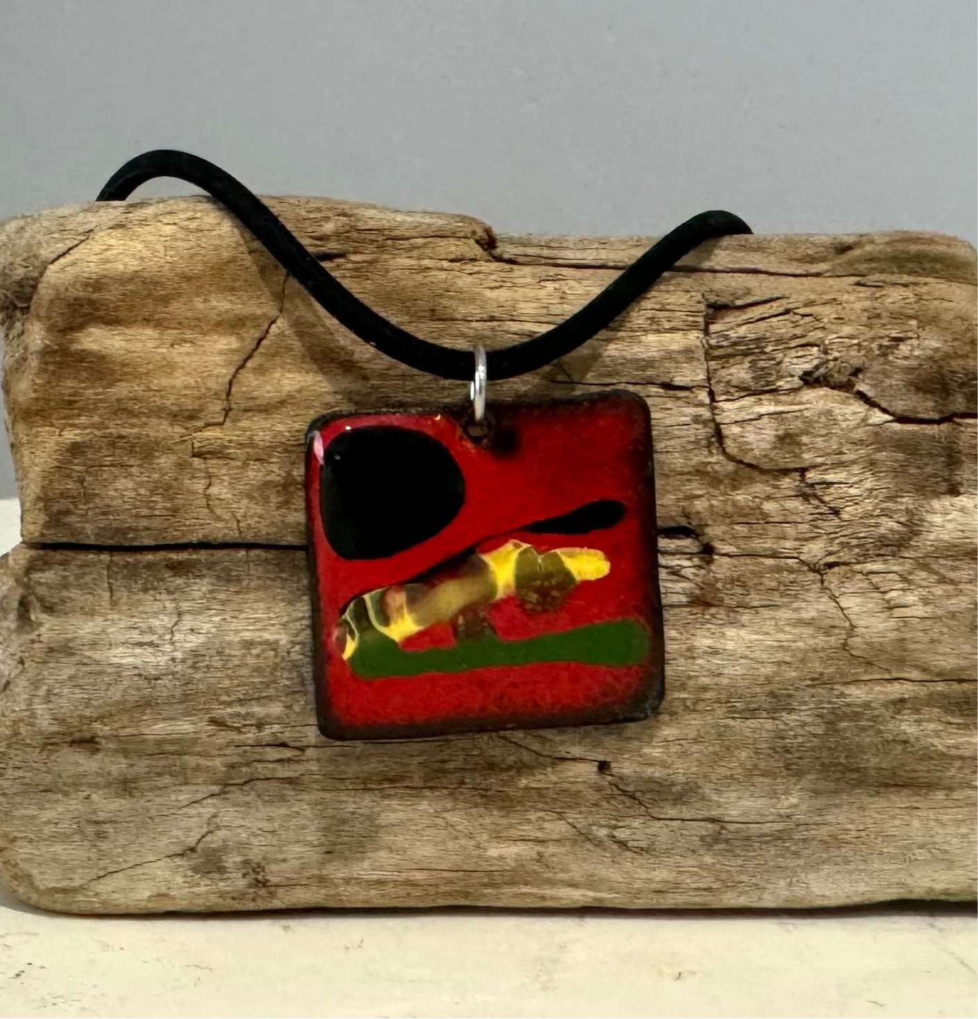 A modern abstract colorful square enamel necklace pendant. Handcrafted