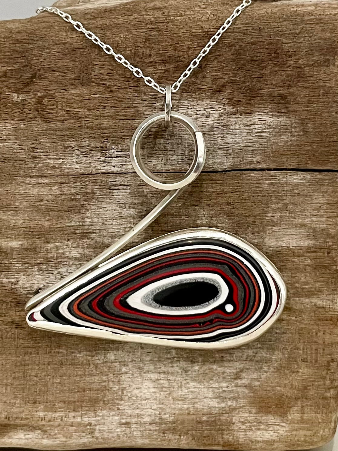 Fordite cabochon set into sterling silver  handcrafted necklace