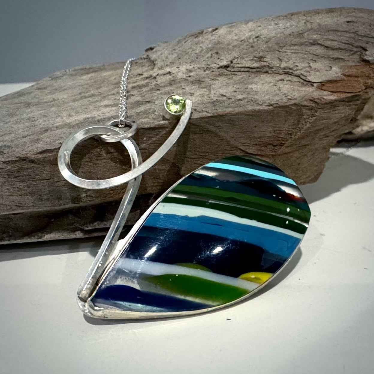 Handcrafted modern Surfite necklace with green peridot. unique and one of a kind