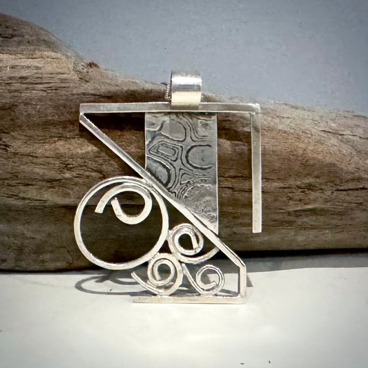 uniquely designed silver necklace with a modern style. handcrafted